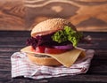 Sandwich on a napkin on a wooden table. Royalty Free Stock Photo