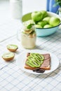 Sandwich with peanut butter and kiwi, green apples, yogurt with banana and kiwi, creative idea for kids breakfast, dessert or Royalty Free Stock Photo