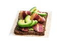 Sandwich with plant-based bacon rashers and avocado isolated on white Royalty Free Stock Photo