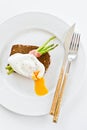 Sandwich with poached egg and baked asparagus. White background, top view. Royalty Free Stock Photo