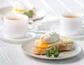 Sandwich with poached egg and fresh cheese