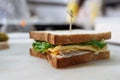 Sandwich in the cooking process on a whiteboard