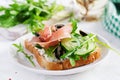 Sandwich with prosciutto, cucumber, black olives, arugula and feta cheese