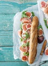 Sandwich prosciutto mascarpone cheese figs wooden table copy spa