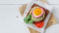 Sandwich with Purple beet pickled eggs, avocado and tomato, copy space. Royalty Free Stock Photo