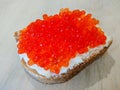 Sandwich with red caviar. White bread with butter. Seafood delicacies Royalty Free Stock Photo