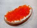 Sandwich with red caviar. White bread with butter. Seafood delicacies Royalty Free Stock Photo