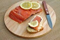 Sandwich with red fish and slice of lemon