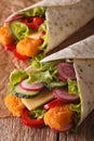 Sandwich roll with fish and vegetables macro. vertical Royalty Free Stock Photo