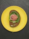 Sandwich rose made on yellow plate