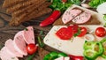 Sandwich of rye bread with boiled sausage on a rustic wooden background Royalty Free Stock Photo