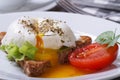 Sandwich with salad, open poached egg