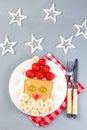 Sandwich with Santa made from toast, peanut butter, strawberry, banana, grape and apple, Christmas menu for kids, vertical, top Royalty Free Stock Photo