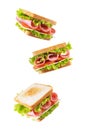 Sandwich with sausage, cheese and tomato on a white isolated background Royalty Free Stock Photo