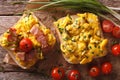 sandwich with scrambled eggs, bacon and tomatoes close-up. horizontal top view Royalty Free Stock Photo