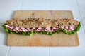 Sandwich with seeds, salami and salad Royalty Free Stock Photo