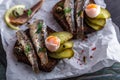 Sandwich with sprats and egg on wooden table, close up Royalty Free Stock Photo