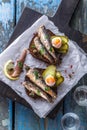 Sandwich with sprats and egg on wooden table, close up Royalty Free Stock Photo