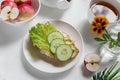 Sandwich spread with cheese and salad and fresh vegetables in the center of the breakfast Royalty Free Stock Photo