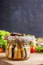 A sandwich with sprots lies on a jar of fish. Copy space Royalty Free Stock Photo