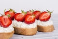 Sandwich of strawberry and cottage cheese on the wooden table Royalty Free Stock Photo