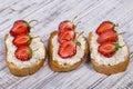 Sandwich of strawberry and cottage cheese on wooden table, close up Royalty Free Stock Photo