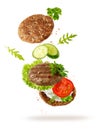 Sandwich toast  with grilled beef cutlet and fresh herbs and vegetables flying isolated on white Royalty Free Stock Photo