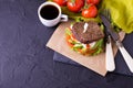 Sandwich with tomatoes, lettuce, avocado and espresso coffee Royalty Free Stock Photo
