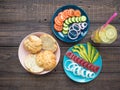 Sandwich with tuna on a plate, vegetables and a glass of lemonade