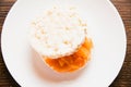 Sandwich with two pieces of crispy rice bread, butter and salted red fish on a white plate Royalty Free Stock Photo