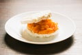 Sandwich with two pieces of crispy rice bread, butter and salted red fish on a white plate Royalty Free Stock Photo