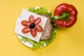 Sandwich with vegetables on a yellow background Royalty Free Stock Photo