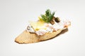 Sandwich with white cheese, dill, olive, lemon on white background