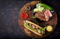 Sandwich of whole wheat bread with roast beef, cucumber and arugula Royalty Free Stock Photo