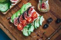 Sandwiche and bruschetta on a cutting board Royalty Free Stock Photo