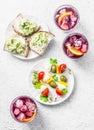 Sandwiches with avocado, canape with mozzarella, tomatoes, olives and aperol spritz Royalty Free Stock Photo