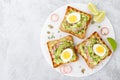 Sandwiches with avocado guacamole, fresh radish, boiled egg, chia and pumpkin seeds. Diet breakfast. Delicious and healthy plant-b