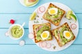 Sandwiches with avocado guacamole, fresh radish, boiled egg, chia and pumpkin seeds. Diet breakfast. Delicious and healthy plant-b Royalty Free Stock Photo