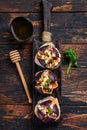 Sandwiches with baked figs, jam and cream cheese. Wooden background. Top view Royalty Free Stock Photo