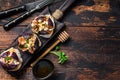 Sandwiches with baked figs, jam and cream cheese. Wooden background. Top view. Copy space Royalty Free Stock Photo