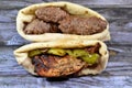 Sandwiches of beef Kofta and tarb kofta shish, minced meat wrapped in lamb fat charcoal grilled and Chicken grilled and roasted on Royalty Free Stock Photo