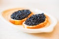 Sandwiches with black sturgeon or beluga caviar close up Royalty Free Stock Photo
