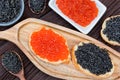 Sandwiches with black sturgeon and red salmon caviar close up Royalty Free Stock Photo