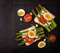 Sandwiches with caramelized asparagus, feta cheese, tomatoes and eggs