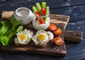 Sandwiches with cheese and fried quail eggs, fresh herbs and cherry tomatoes, Greek yogurt, celery and pepper. Healthy breakfast o Royalty Free Stock Photo