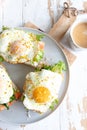 Sandwiches with cream cheese, fresh green salad, salmon and baked egg Royalty Free Stock Photo