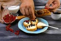Sandwiches with cream cheese ricotta, blueberries and honey on the whole grain bread bruschetta. chef cook prepares sweet berry cr Royalty Free Stock Photo