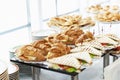 Sandwiches croissants on the buffet table. Coffee break and business meetings. Close-up Royalty Free Stock Photo