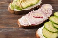 Sandwiches with , cucumber , cheese and avocado slices, red onion Royalty Free Stock Photo