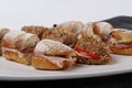 Sandwiches cutted into peaces with different breads and fillings